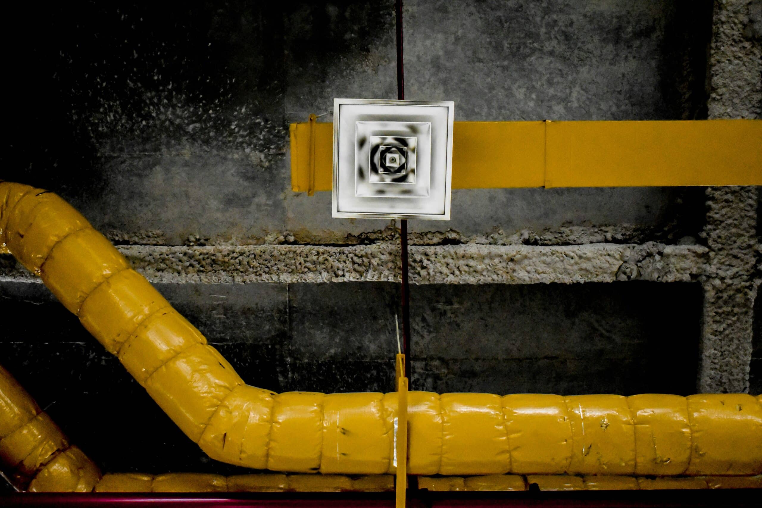 Ventilation duct and air vent in an industrial confined space, indicative of the complex environments Detroit Confined Space Emergency Response teams operate in.